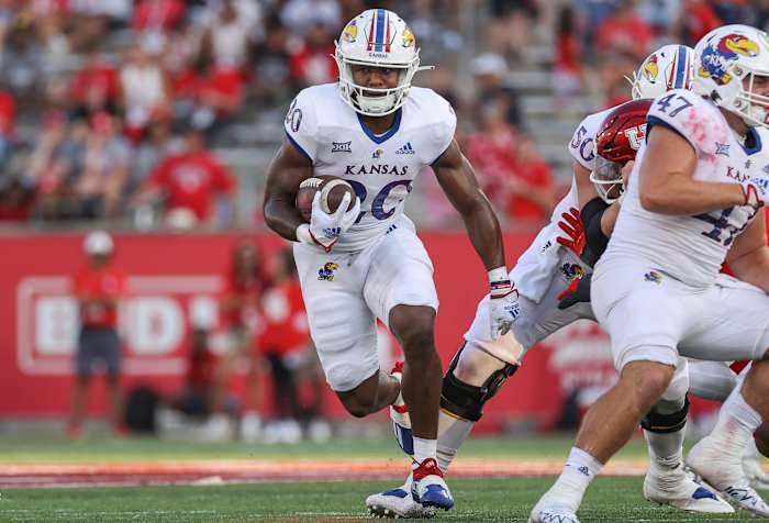 Sep 17, 2022; Houston, Texas, USA; Kansas Jayhawks running back Daniel Hishaw Jr. (20) runs with the ball during the fourth quarter against the Houston Cougars at TDECU Stadium. Mandatory Credit: Troy Taormina-USA TODAY Sports